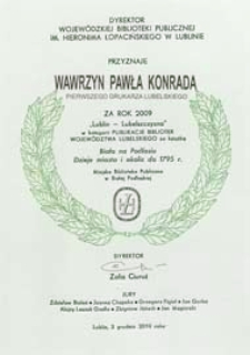 Wawrzyn Pawła Konrada za rok 2009 "Lublin - Lubelszczyzna" w kategorii "Publikacje bibliotek województwa lubelskiego" za książkę " Biała na Podlasiu. Dzieje miasta i okolic do 1795 roku"